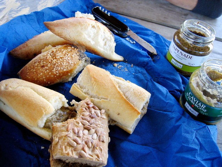 A picnic lunch of organic bread with the Provencal specialties tapenade (olive paste) and caviar d'aubergine (eggplant spread) in a covered shelter at the Marais du Vigueirat, south of the city of Arles, France, in November 2006. The Marais du Vigueirat is a wildlife refuge just outside the Park of the Camargue in southern Provence. (AP Photo/Ann Levin)