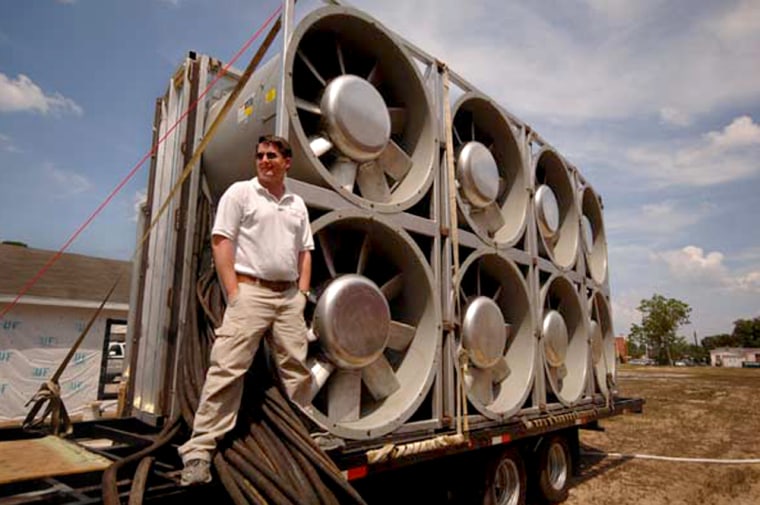University of Florida wind engineering researcher Forrest Masters stands on a newly completed, fully portable hurricane wind simulator on May 29, 2007. 