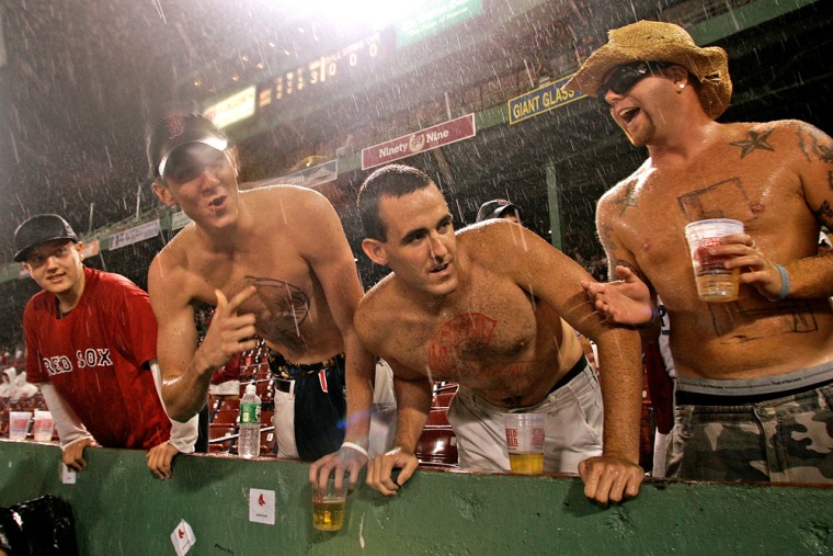 Boston Red Sox fans peer into the Red Sox dugout during a rain delay at Fenway Park. The best time to see the boys of summer in action is — well, the summer — but no matter what time of year you visit Boston, you can always take a tour of Fenway Park for a behind-the-scenes look at one of baseball’s most famous franchises. 