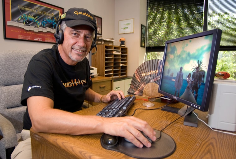 Guy Buckmaster, a marketing director, sits at a computer as he demonstrates an online game "Guild Wars," that he regularly plays with his six children in Clearwater, Fla. "It's allowed me to be a continuing influence and provide guidance in their life, and that's important to me," said Buckmaster. 