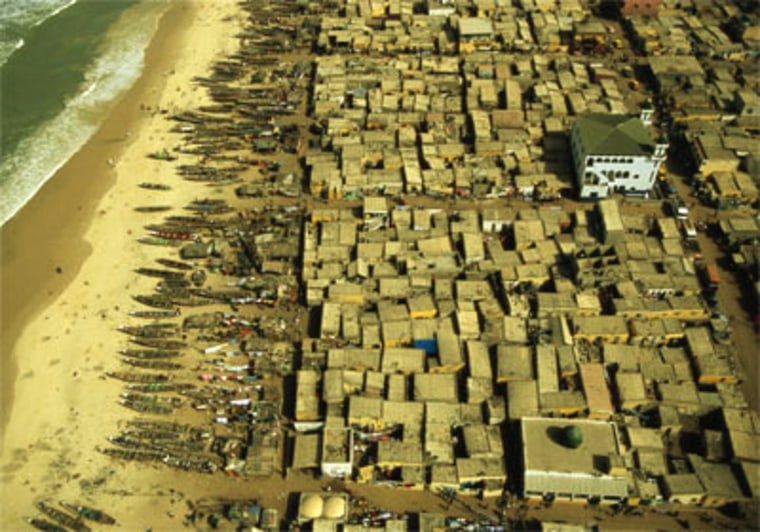 Banjul, Gambia. Coastline with boats and houses.