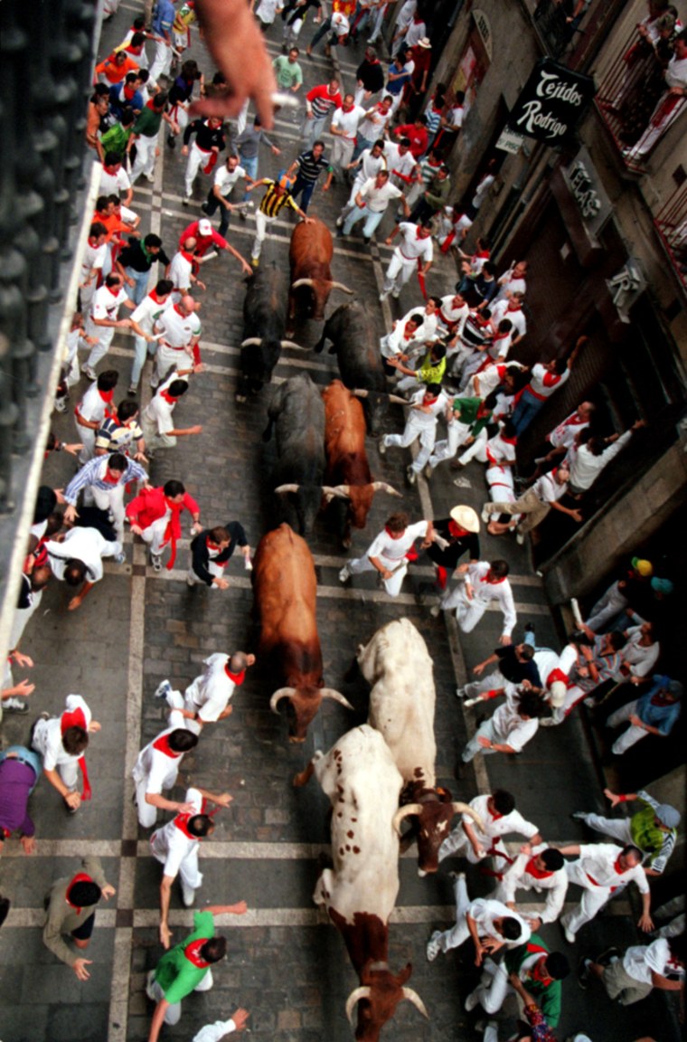 Pamplona Spain. 07/20/2003. THe running of the bulls.Each year many people rent out balconies so people can get a birds eye view of the running.  View from a balcony on the Estefeta , the longest straight stretch of the half mile run from the corral to the bull ring. There are six fighting bulls accompanied by several steers.. Don Smith/ The Record ...fiesta