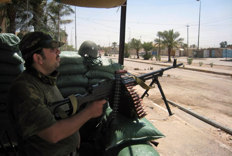 An Iraqi army soldier monitors an area a