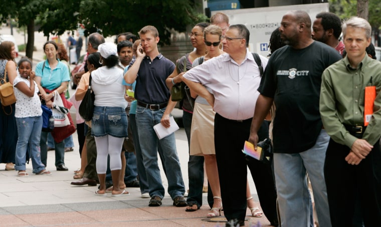 People wait in line outside the U.S. Passport Office in downtown Washington on Wednesday for processing. 