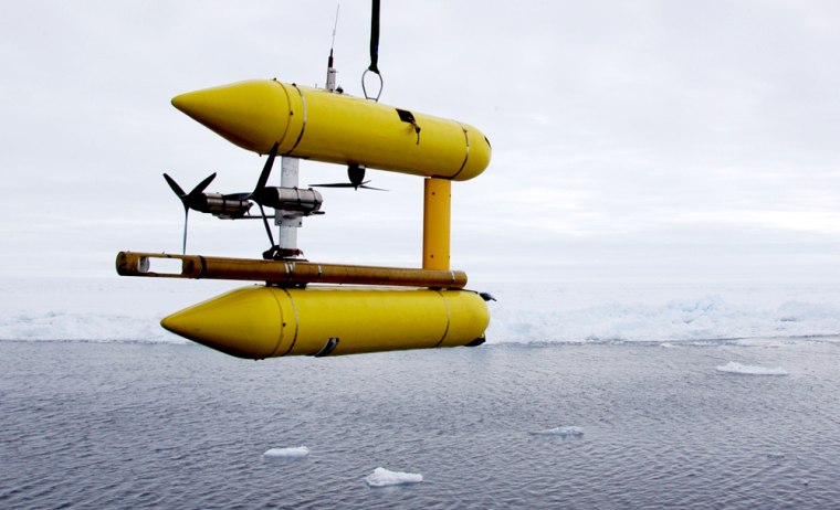 This photo provided by Woods Hole Oceanographic Institution on Cape Cod, Mass., shows the deployment of a new robotic underwater vehicle named \"Puma\"  into the Arctic Ocean from the icebreaker Oden during a test cruise on Sunday, June 3, 2007. Scientists from the institute plan to use it and other newly developed robots to sample new life they believe may be found along a series of underwater hot springs on rugged Gakkel Ridge in the Arctic. (AP Photo/Woods Hole Oceanographic Institution, Hanumant Singh)   ** NO SALES **