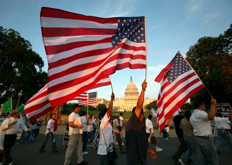 Protesters for immigrant rights march past the Capitol Building in Washington