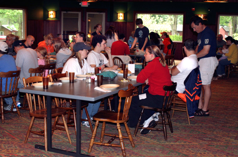 ** FOR IMMEDIATE RELEASE **Guests to the Pennellwood Resort eat lunch together in the dining hall of the Pennellwood lodge, May 26, 2007, in Berrien Springs, Mich. Lunch is served precisely at noon and guests are alerted by a ringing bell. For more than a century, parents and children have reconnected at Pennellwood Resort, which during the summer offers getaway weekends as well as weeklong vacations in a wooded setting on 24 acres alongside Lake Chapin in Berrien Springs, about 70 miles east of Chicago in southwestern Michigan. (AP Photo/James Prichard)