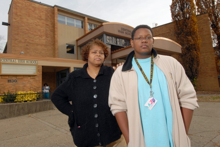 Deborah Stallworth and her son, Austin Johnson, 15, stand in front of Central High School on Nov. 27, 2006, in Louisville, Ky., where he's a student. Stallworth was unhappy when her son was initially denied admittance to his neighborhood school and instead assigned to a school across Louisville that would have required "busing my baby halfway to Timbuktu," as she recalls it. 