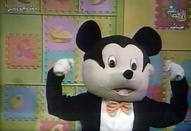 A giant black-and-white Mickey Mouse lookalike named "Farfour," or "butterfly," talks on a children's show in Gaza City on May 11 in an image taken from Al Aqsa TV, a station run by Hamas.