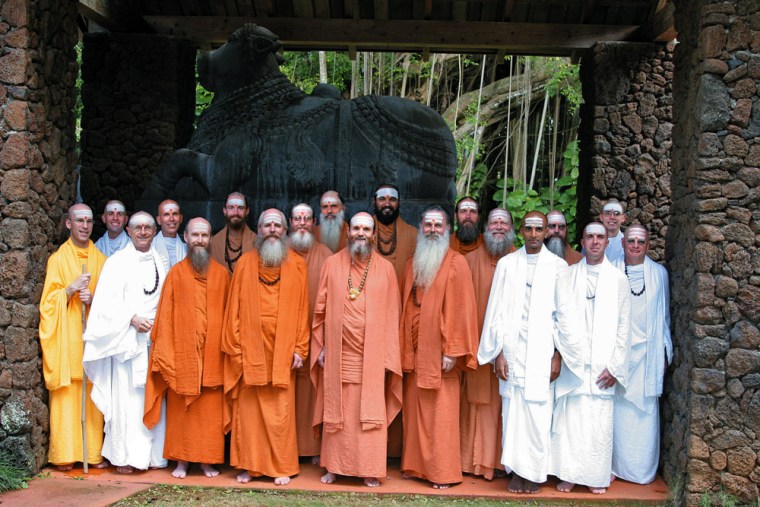 ** ADVANCE FOR FRIDAY PMS, JUNE 29 **This undated photo provided by Kauai Aadheenam, Kauai's Hindu Monastery, shows monks posing at the monastery beside the Nandi statue at the Kadavul Temple on Hawaii's Kauai Island. The Hindu monastery's new, all stone temple is expected to take up to 10 more years to complete. (AP/Courtesy Kauai Aadheenam).