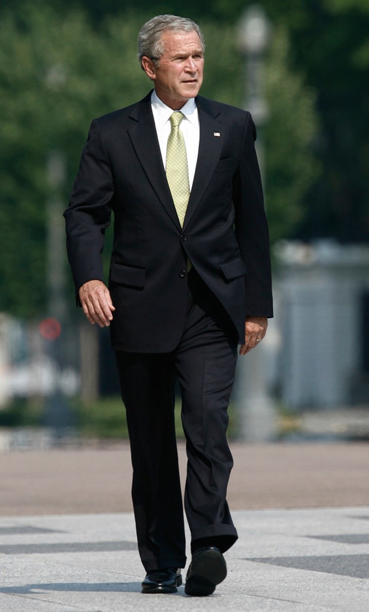 U.S. President Bush walks to a farewell party for Dan Bartlett in Washington