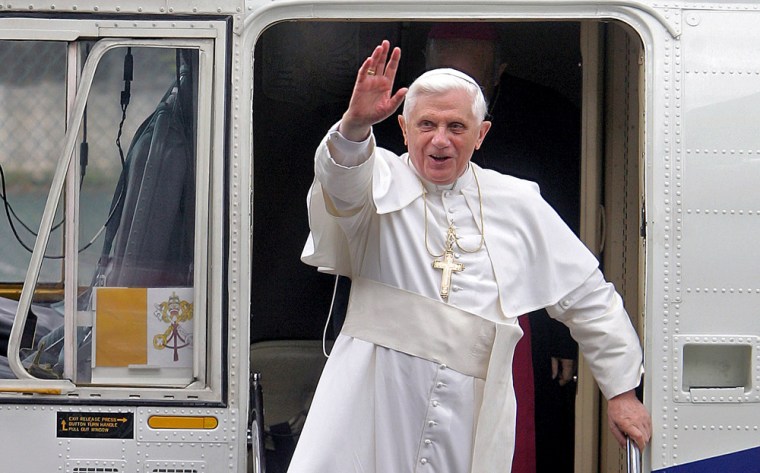 Pope Benedict XVI waves at faithful as h
