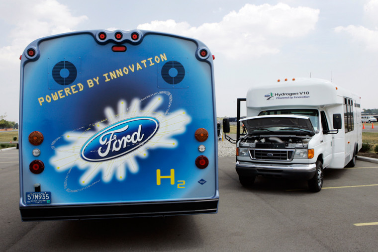 Ford 12-passenger parking lot shuttle buses powered by a 6.8-liter internal combustion hydrogen engine are shown in Dearborn, Mich.