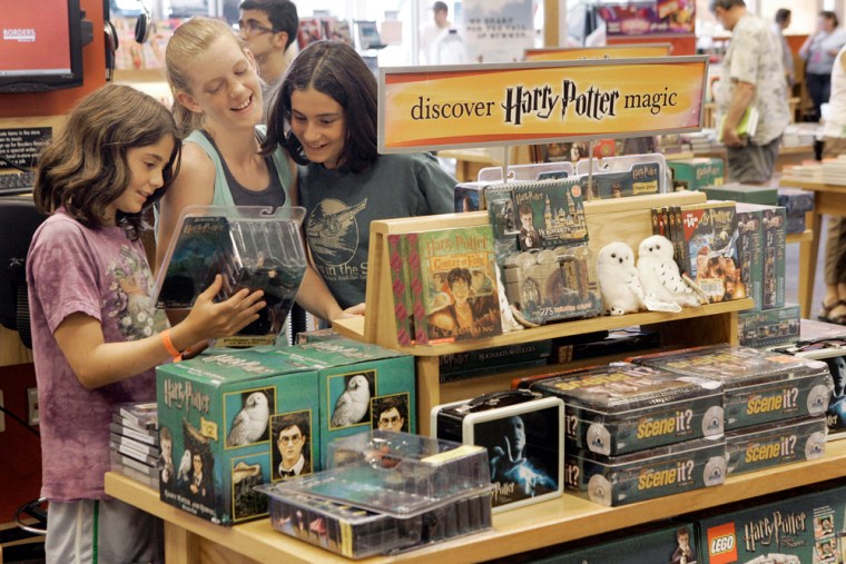 Julia DeRogatis, 11 left, and her sister Andi DeRogatis, 13, both of Goleta, Calif., view Harry Potter merchandise with their cousin Claire McCarthy, 12, of Walled Lake, Mich., at a Borders store in Novi, Mich., June 28, 2007.