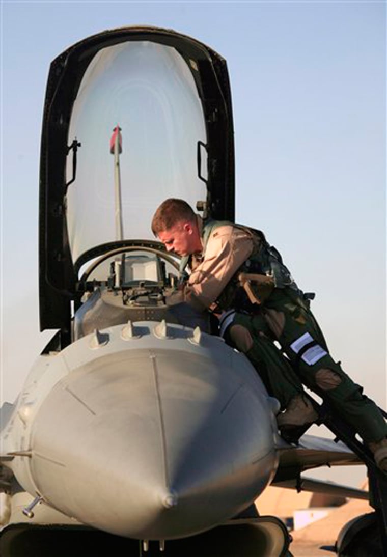 U.S. Air Force Capt. Shaun Germain prepares to pilot his F-16 Falcon at Balad Air Base, 50 miles north of Baghdad, on June 21. Air Force and Navy aircraft dropped 437 bombs and missiles in Iraq in the first six months of 2007, a fivefold increase over the 86 used in the first half of 2006, according to Air Force data.