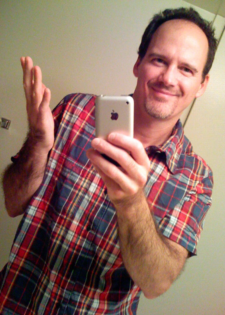 Joe Hutsko, technology writer for MSNBC.com, shoots a self portrait using an Apple iPhone. He spent a week living with the device as his only communication device.