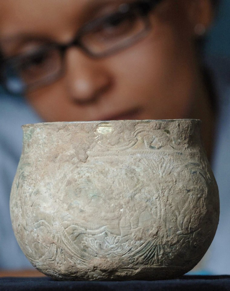 A gilt silver vessel dating back to the ninth century is shown at the British Museum Thursday July 19 2007.  One of the biggest Viking treasures ever found has been discovered on an English farm by a father-son team of treasure hunters, the British Museum said Thursday. The trove of coins and jewelry was buried more than 1,000 years ago _ a collection of items drawn from Ireland, France, Russia and Scandinavia in a testament to the raiders' international reach and terrifying power.  (AP Photo/ Stefan Rousseau/PA Wire)   ** UNITED KINGDOM OUT NO SALES NO ARCHIVE **