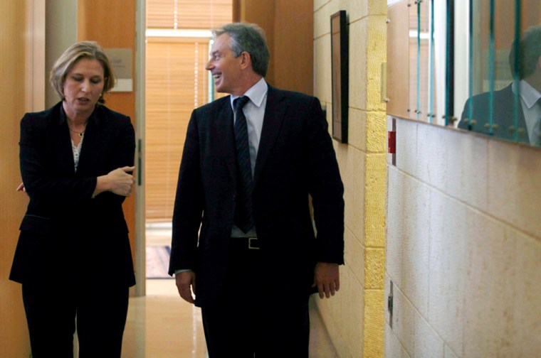 Israel's FM Livni and Tony Blair walk together in jerusalem