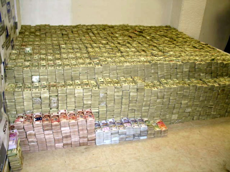 **  FILE  ** This March 16, 2007 file photo provided by Mexico's Attorney General's office shows the largest seizure of cash in the history of drug enforcement, around US$ 207 million seized at Zhenli Ye Gon's home, a Chinese-Mexican businessman in Mexico City. Mexican federal officials said on Monday, July 23, 2007, that alleged drug trafficker Zhenli Ye Gon, who is tied to the largest seizure of drug cash in world history, has been arrested in Rockville, Maryland. He is wanted in Mexico on organized crime, drug trafficking and weapons charges and Mexican officials have requested his arrest for extradition.  (AP Photo/PGR)  ** NO SALES  **  NO ARCHIVE **