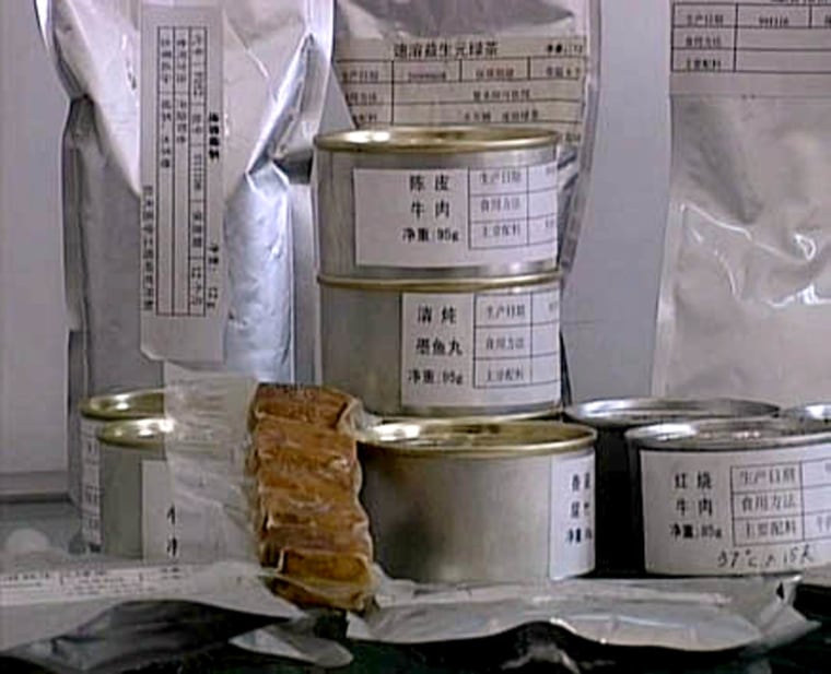 The food concocted for Chinese astronauts, shown here in a space exhibit, comes in standard-issue cans and bags — but Chinese supermarkets are due to offer versions of the same food dressed up for consumers.