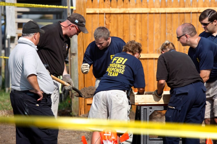 FBI Evidence team searches Ocean City home back yard after 4 dead premature fetuses were found at premises.
