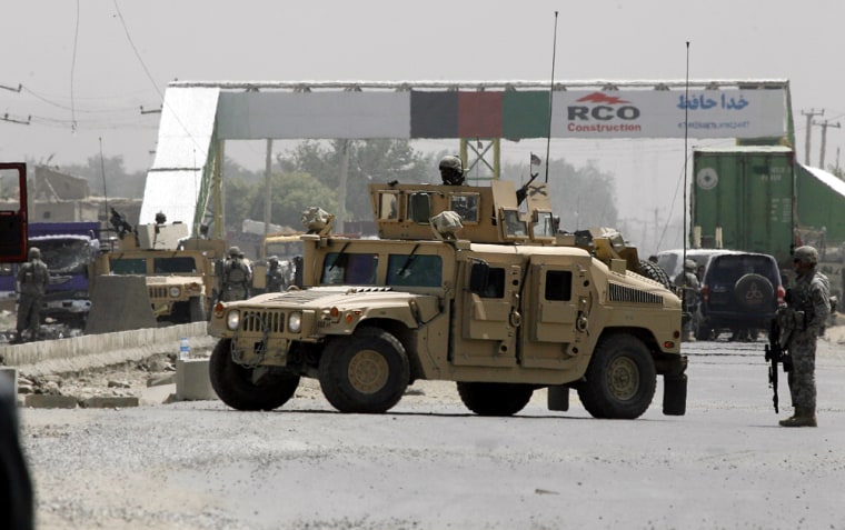 A U.S. military vehicle is parked on a road near the site of a suicide blast in Kabul