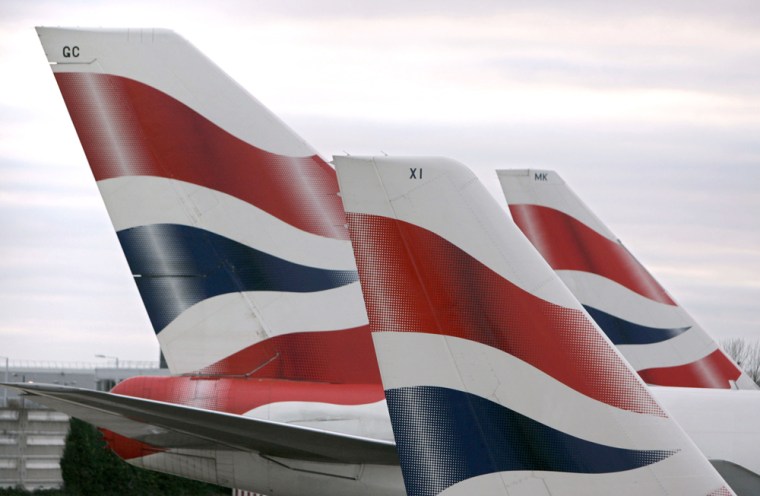 File photograph shows the tail fins of British Airways aeroplanes on the tarmac at London's Heathrow Airport