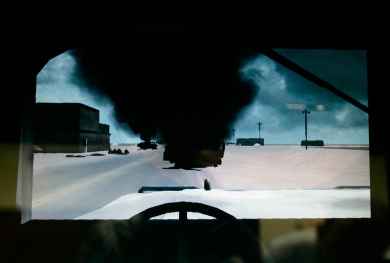 ** ADVANCE FOR AUG. 4-5 WEEKEND EDITIONS ** This computer-screen photo taken Friday, June 29, 2007 of an experimental virtual-reality computer simulation at Madigan Army Medical Center at Fort Lewis, Wash. shows a first-person view of a simulated attack on a military convoy in Iraq. Psychologists plan to begin using virtual reality in the future to treat soldiers suffering from post-traumatic stress disorder. (AP Photo/Ted S. Warren)