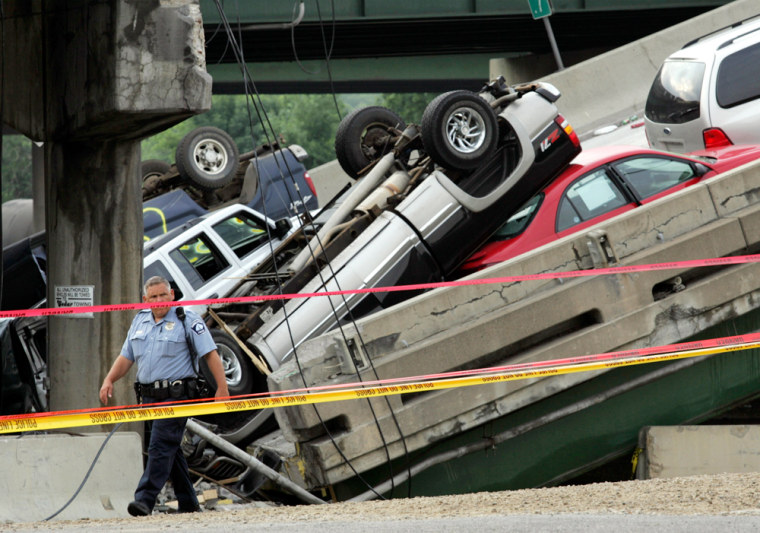 Police officer walks near wreckage on collapsed bridge