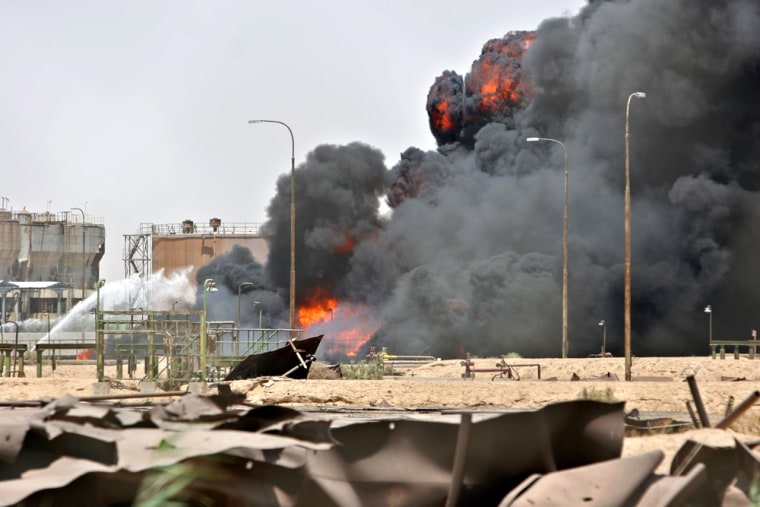 An oil pipeline burns in central Basra on Aug. 4 after a battle between British forces in the air and insurgents on the ground.