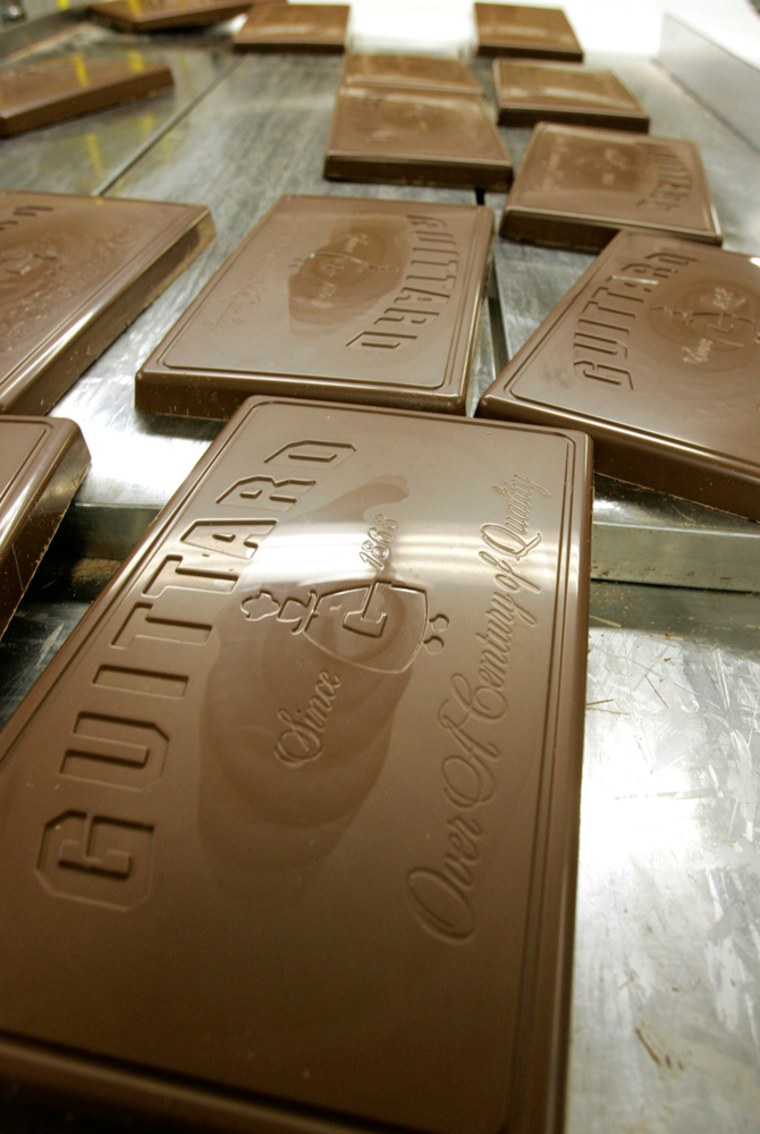 Ten pound bars of milk chocolate are shown at Guittard Chocolate Co. in Burlingame, Calif. Like many battles, this one's being fought block by block.