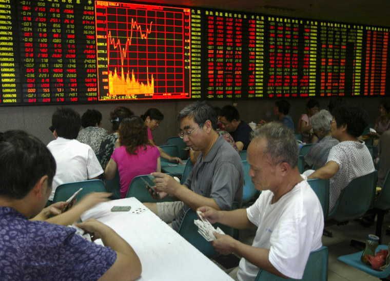 People play cards at a stock exchange in Nanjing