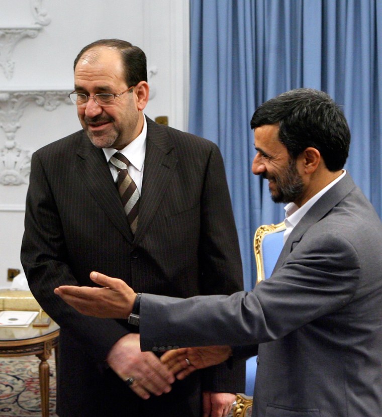 Iranian President Mahmoud Ahmadinejad welcomes Iraq's Prime Minister Nuri al-Maliki in Tehran