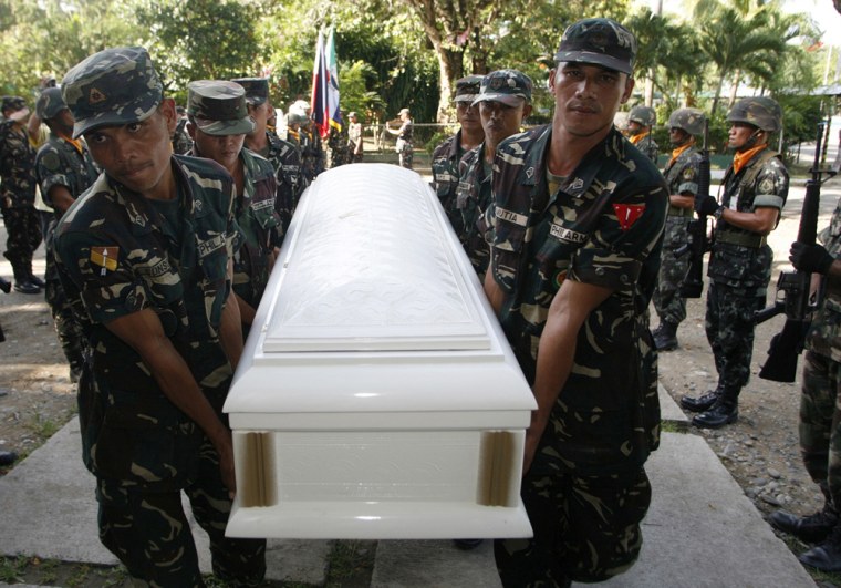 Pallbearers carry casket as Philippine army gave military honours to fallen soldiers in Zamboanga City