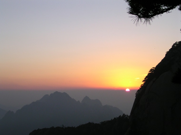 A sunset is seen over Huangshan — or Yellow Mountain, in southeast China. Huangshan in Anhui province, with its distinctive pines and rolling clouds, has some of the most beautiful scenery in the area.