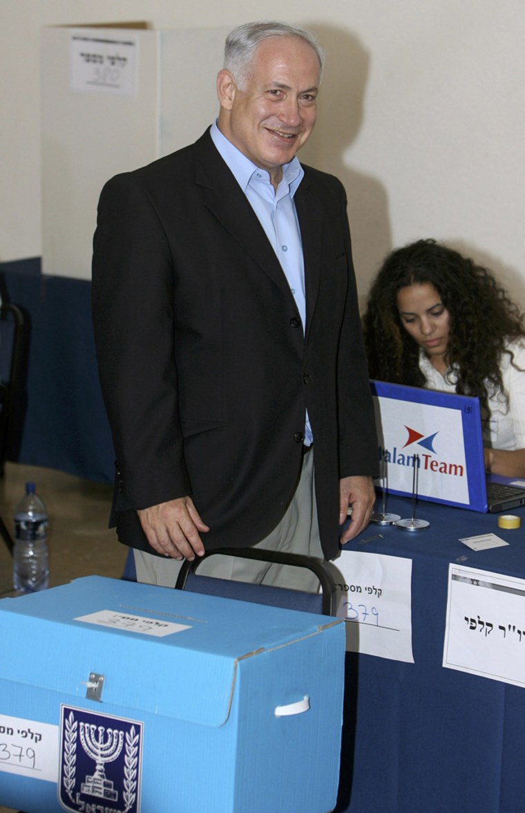 Israeli opposition leader Netanyahu walks near a ballot box in Jerusalem