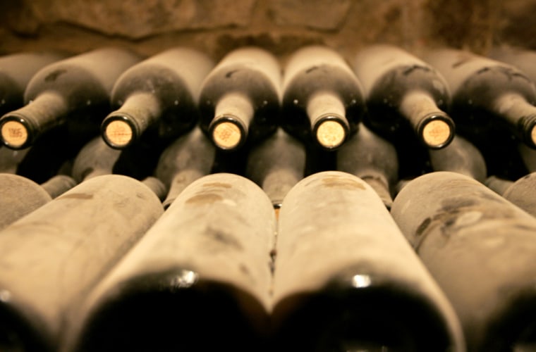 ** FOR IMMEDIATE RELEASE **Dust gathers on bottles of wine aging in a cellar at the Castello di Amorosa in Calistoga, Friday, May 18, 2007. Daryl Sattui set out to build a modest, 8,500-square-foot winery. Millions of dollars and 120,000 square feet later he's king of a wine country castle complete with drawbridge, dungeons and nifty little slots for the old boiling oil trick. (AP Photo/Eric Risberg)