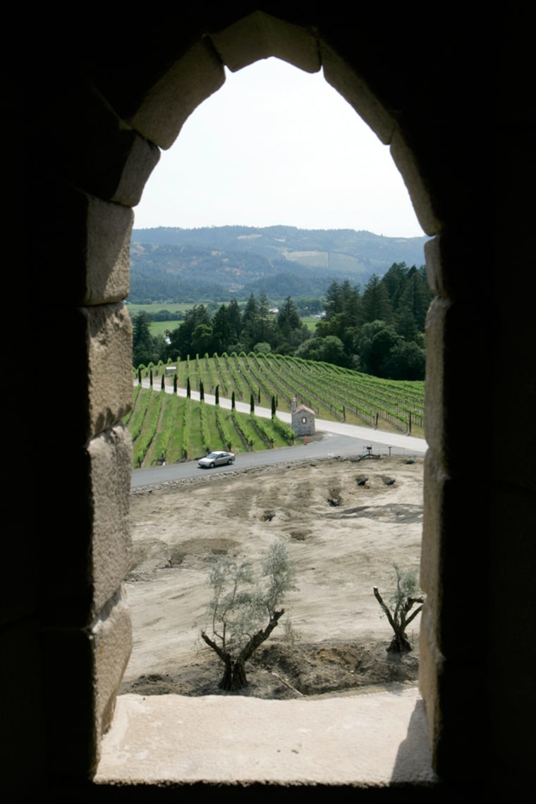 ** FOR IMMEDIATE RELEASE **The main drive up to the Castello di Amorosa is shown through a tower window in Calistoga, Calif., May 18, 2007. Daryl Sattui set out to build a modest, 8,500-square-foot winery. Millions of dollars and 120,000 square feet later he's king of a wine country castle complete with drawbridge, dungeons and nifty little slots for the old boiling oil trick. (AP Photo/Eric Risberg)