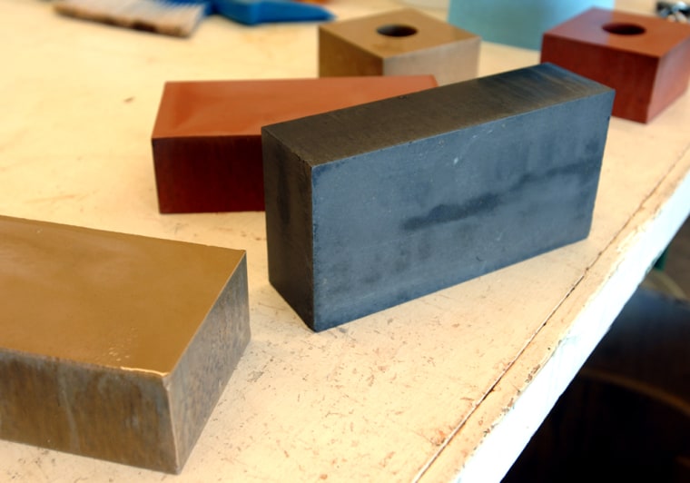 ** FILE ** This file photo from April 19, 2006, shows bricks made of fly ash, a fine powder loaded with mercury, lead and other toxic chemicals which is the byproduct of coal-burning power plants, in Columbia, Mo. New technology increasingly used at coal-fired power plants that is meant to bring cleaner skies could lead to millions more tons of potentially harmful ash in landfills across the nation, as chemicals injected into many plants' emissions to capture airborne pollutants change the composition of the ash and cut its usefulness. It can't be used in cement, for example, because the interaction of the chemicals may keep the concrete from hardening. (AP Photo/L.G. Patterson)