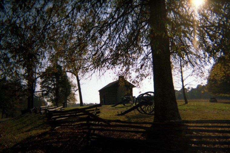 The Brotherton Cabin, built with 1860s logs where the original stood during the Civil War, is shown through the trees at the Chickamauga Battlefield, the largest of the various sites included in the Chickamauga and Chattanooga National Military Park in Tennessee, in this Nov. 12, 2005, file photo.  (AP Photo/Giovanna Dellorto/FILE)