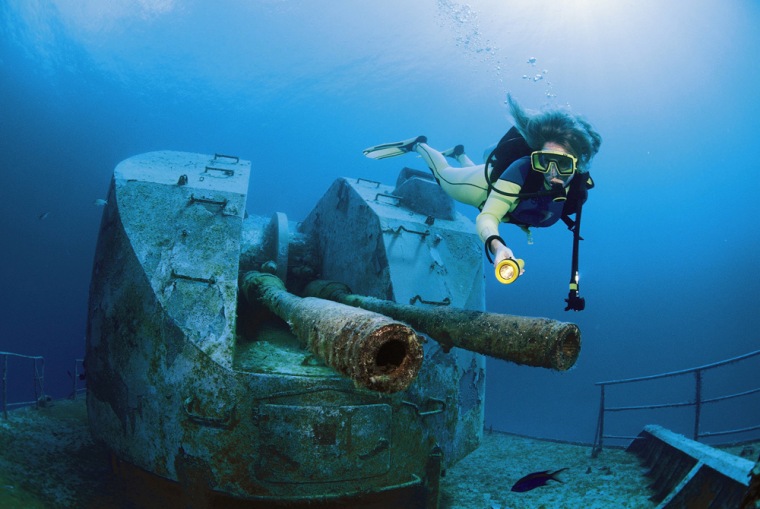 A diver examines the wreck M/V Keith Tibbetts, a Russian destroyer sunk for diving purposes, near the island of Cayman Brac.