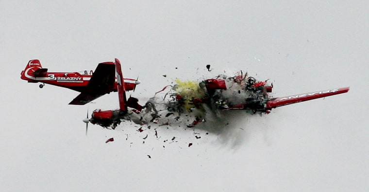 Two acrobatic planes from the Zelazny group collide during a performance at an air show in Radom, Poland, on Saturday. The accident, which killed two pilots, happened far away from spectators.
