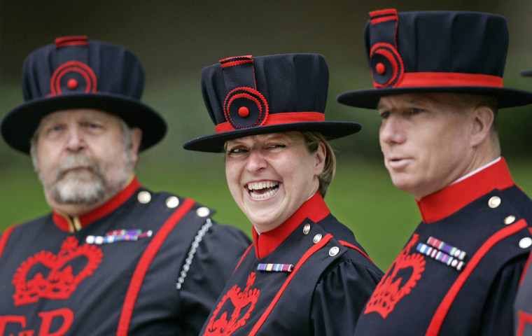 Yeoman Warder Moira Cameron, center, starts work as the first female Beefeater at the Tower of London, on Monday.