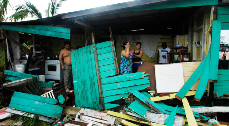 Residents of Puerto Cabezas, Nicaragua, survey the remains of their home on Wednesday. Felix destroyed about 5,000 homes when it slammed into Nicaragua on Tuesday as a Category 5 hurricane.