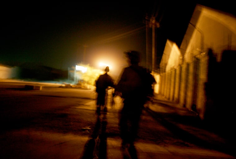 U.S. soldiers patrol at night in Zafraniya neighbourhood, southeast of Baghdad