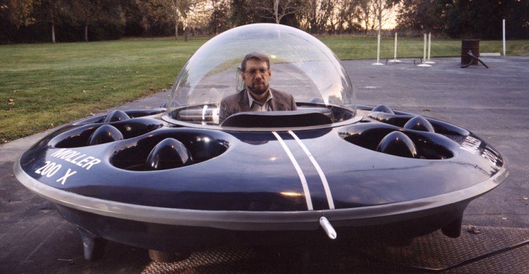 Paul Moller, the face of flying cars, takes the wheel of his first airborne vehicle — a flying saucer that hovers around 10 feet off the ground.