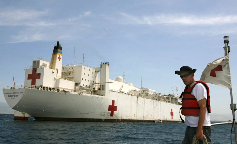 The U.S. Navy hospital ship USNS Comfort is seen anchored near the port in Port-au-Prince, Monday, Sept. 3, 2007. The floating hospital, that carries hundreds of medical volunteers, docked in Haiti last Saturday to provide free vaccinations, eye exams, dental treatment and surgical procedures for local residents on its last stop of a regional goodwill mission. (AP Photo/Ariana Cubillos)