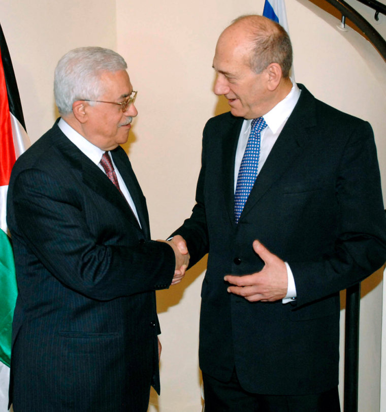 Israel's Prime Minister Olmert shakes hands with Palestinian President Abbas during meeting in Jerusalem