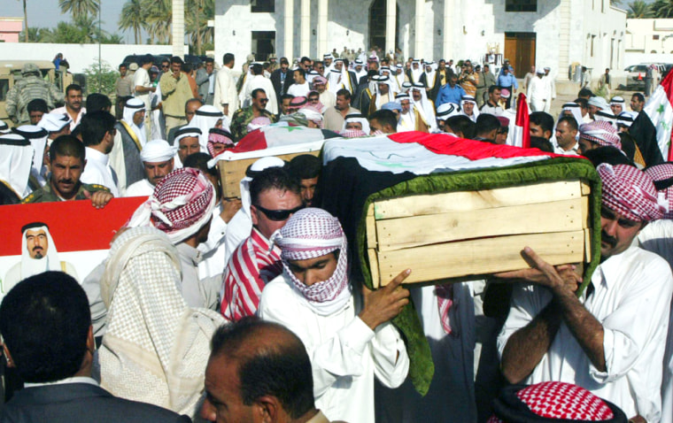 Men carry the coffin of Abdul Sattar Abu Risha, a Sunni Arab tribal leader and his bodyguards, who were killed by a roadside bomb attack on Thursday, during a funeral in Ramadi