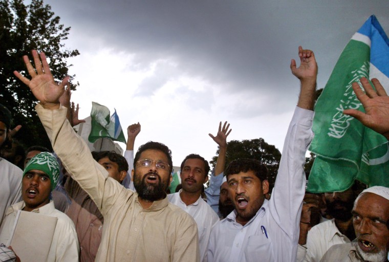 Supporters of an alliance of Pakistani religious parties chant anti-government slogans after a court hearing on a petition to challenge the legality of President Gen. Pervez Musharraf's dual role.
